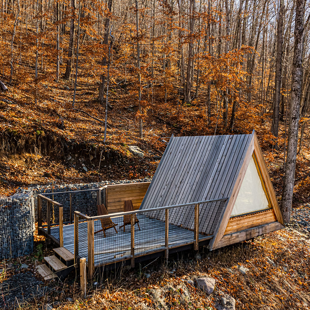 The second hotel from Eastwind, in Oliverea Valley, places its signature A-frame cabins in a secluded forest.