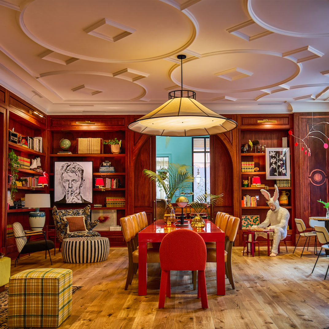 A lounge space featuring the bunny-man statue, the perfect blend of city color and Virgin funkiness at Virgin Hotels New Orleans. ©Virgin Hotels
