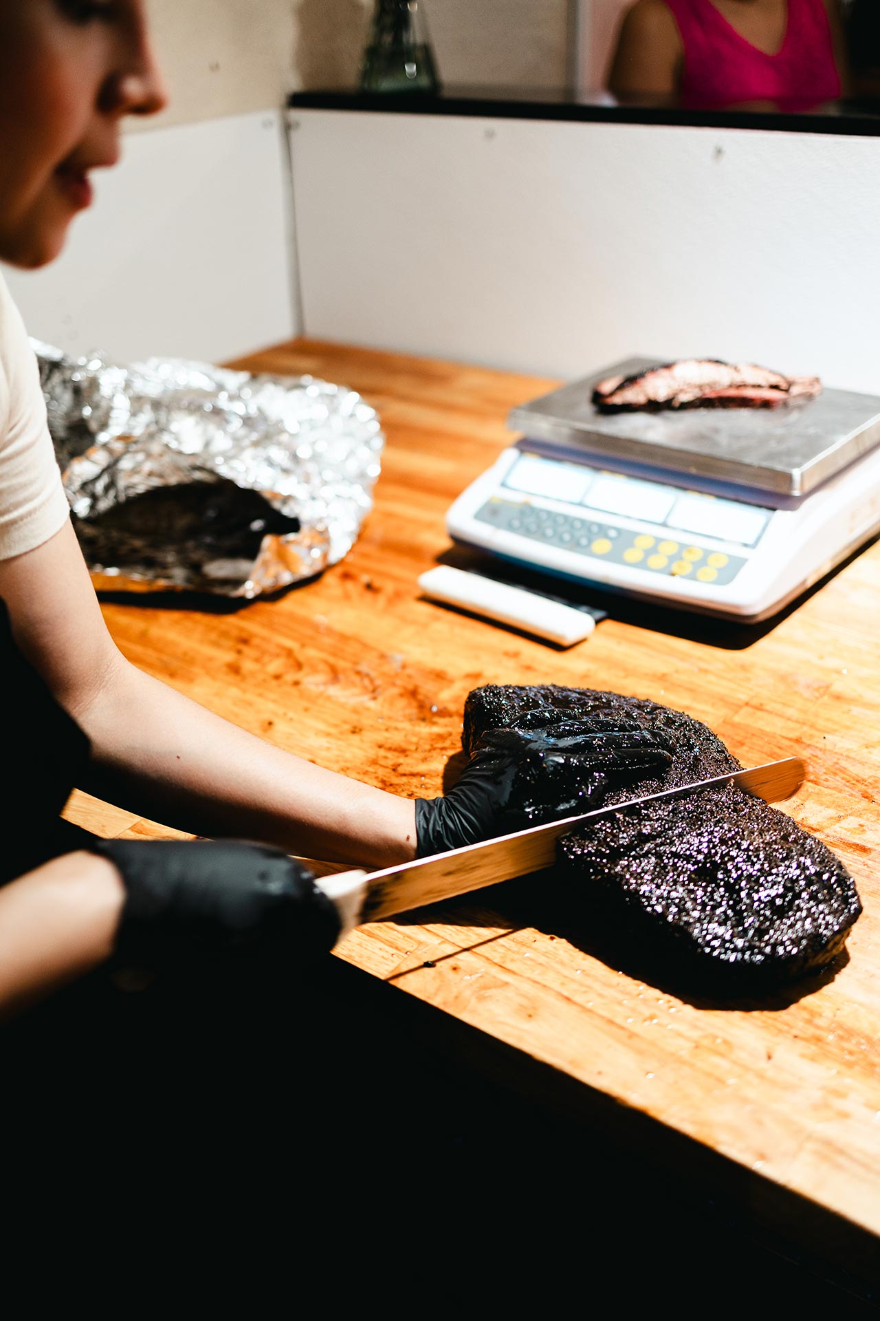 Chuck Charnichart cutting the brisket