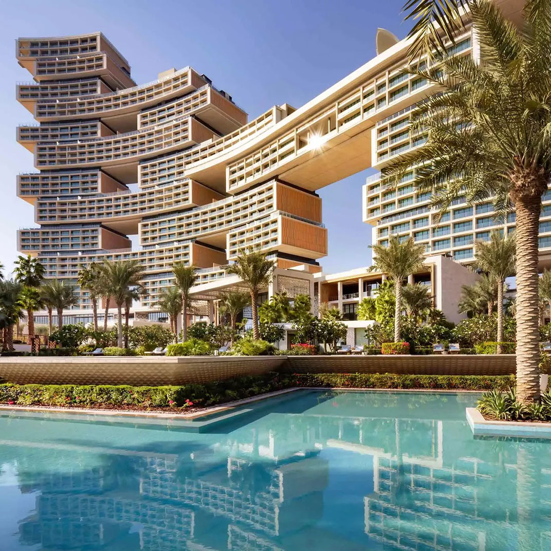 A signature rooftop features an infinity pool with sweeping skyline views above The Palm in Dubai. © Atlantis The Royal