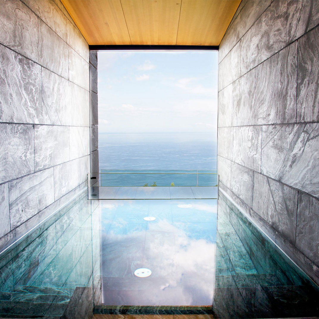 Akelarre’s minimalist spa architecture frames the Bay of Biscay, and floor-to-ceiling windows and reflective pools blur the line between indoor sanctuary and the Basque coast. © Akelarre 