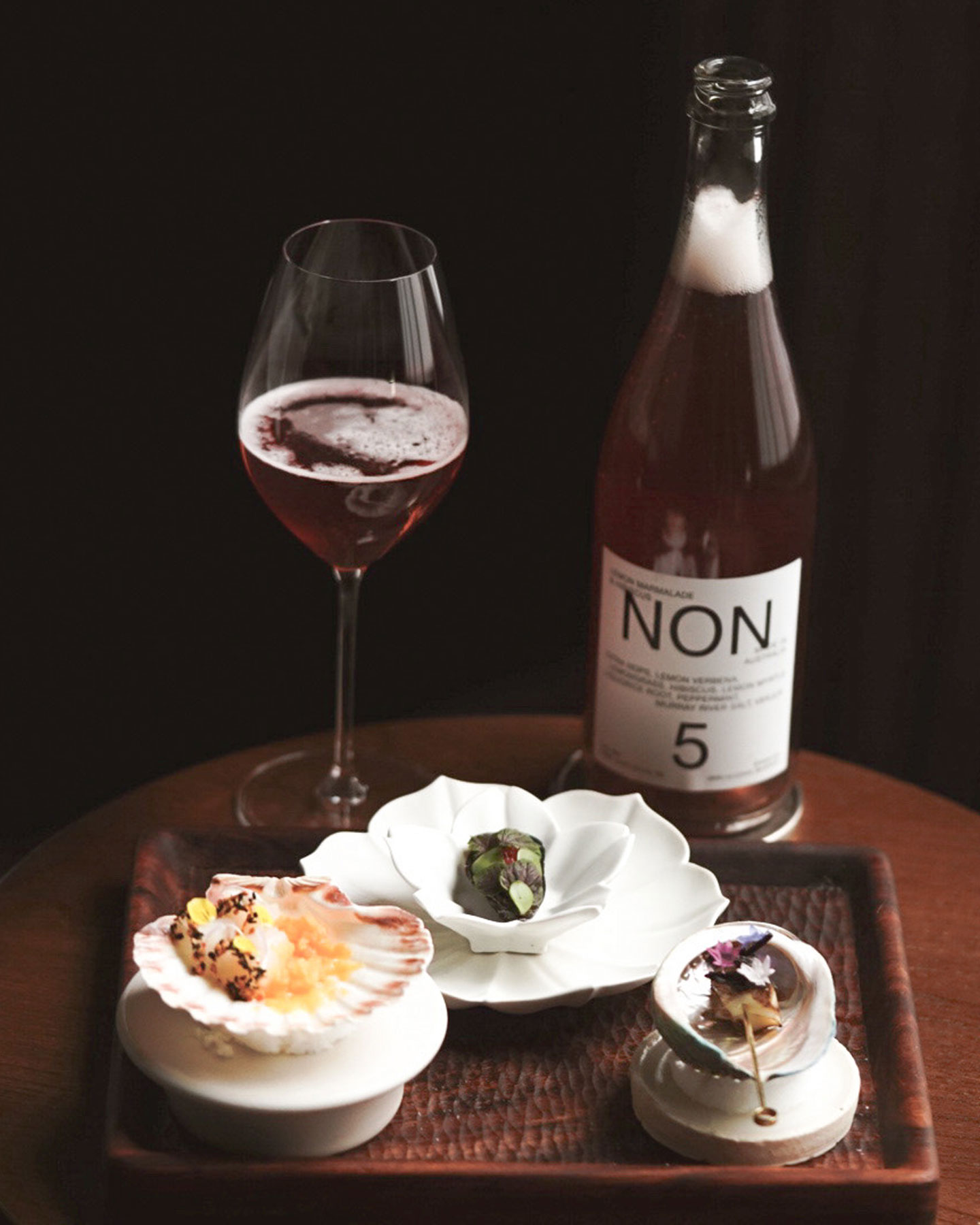 Non “5” poured alongside Maine Scallop, PEI Mussel, and Australian Green Abalone with Buddhas Hand, Black Lime, and Yuzu)  - ©Emily Rosenfeld /Oriole