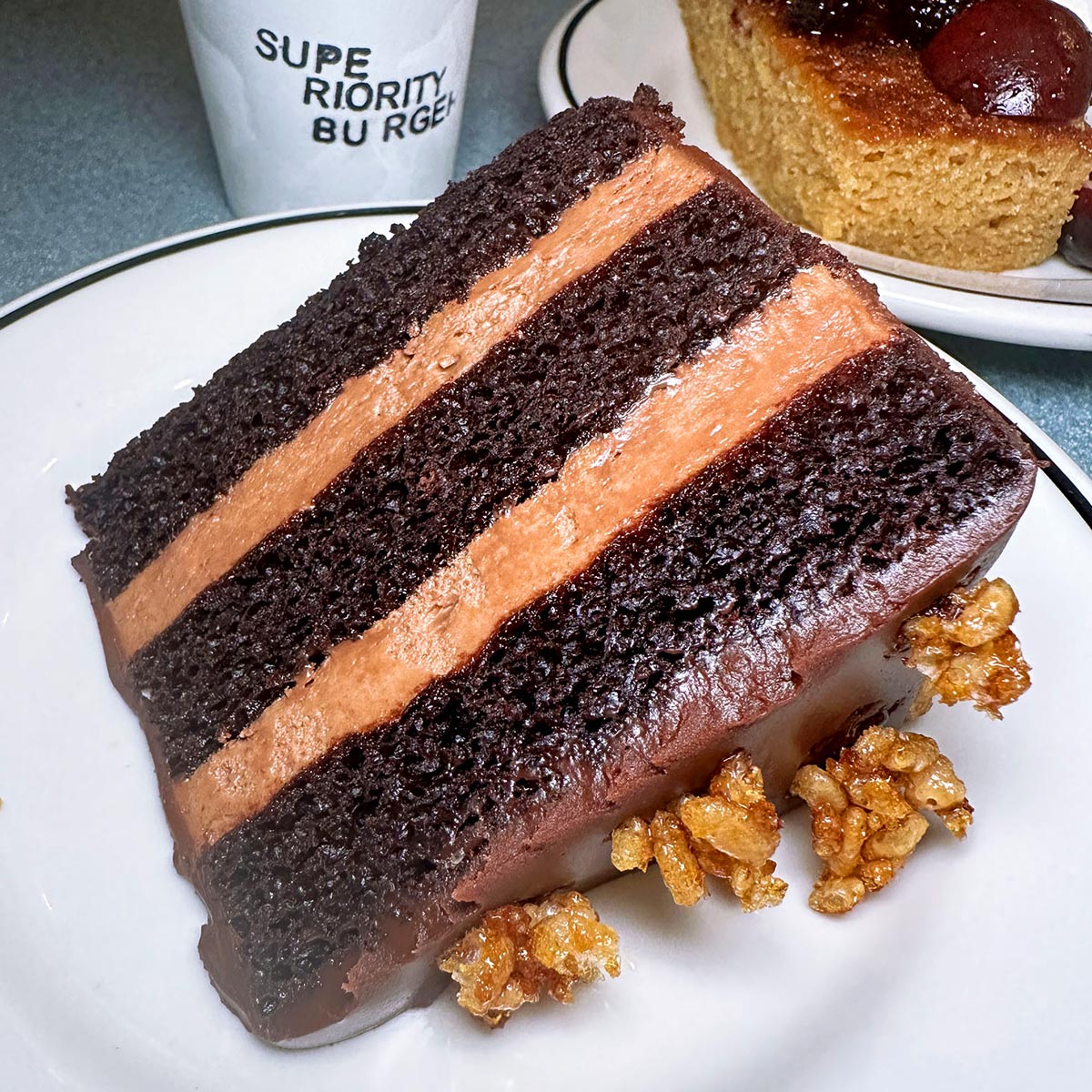 Vegan chocolate mousse cake with candied pear chunks and caramelized rice krispies - ©Mike J Chau/Superiority Burger