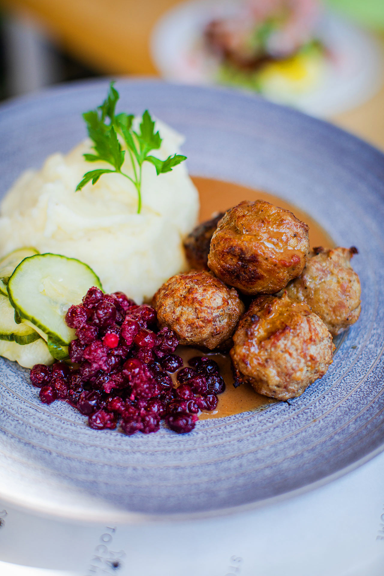 Swedish meatballs at Stockhome, with mashed potatoes, picked cucumbers, and lingonberry jam. ©Stockhome