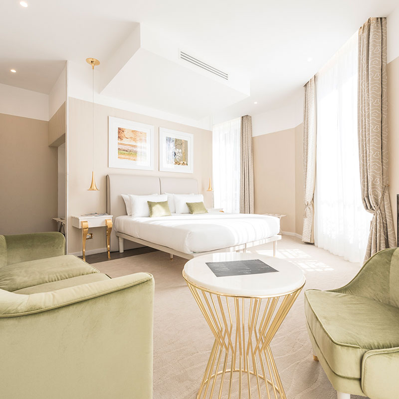 Empty luxury hotel room in Lyon France with elegant seating area